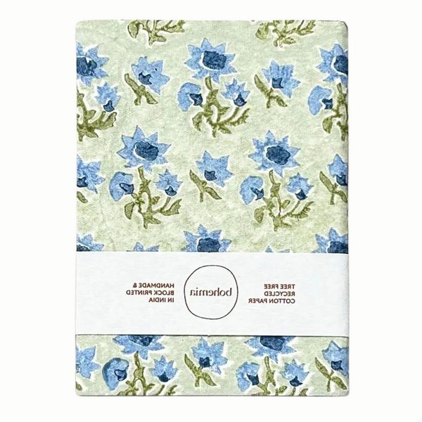 A cotton paper notebook with a vintage blue and green floral design.